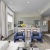 a living room with a table and chairs