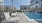 a pool with chairs around it