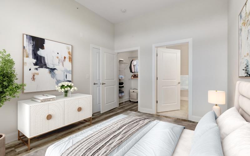 a white room with a bed and a couch