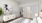 a white room with a bed and a couch