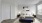 a bedroom with a bed and a bench