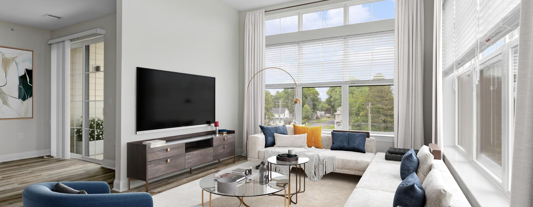 a living room with a tv and couches